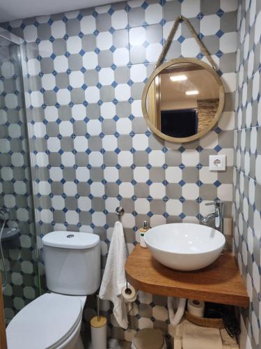 a bathroom with a sink and a mirror at Casa da Alta in Coja