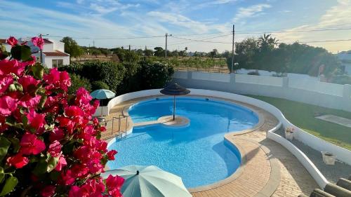 a swimming pool on the roof of a house at Nicola - Private Pool - 8 Guests - Albufeira in Albufeira