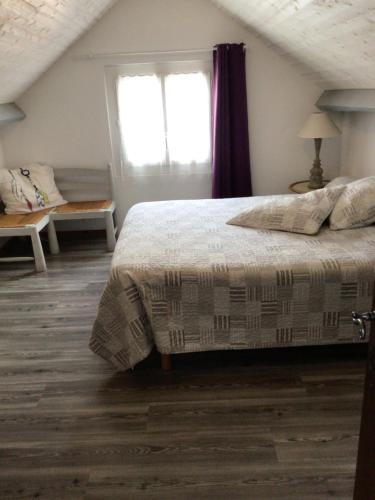 a bedroom with a bed and a window at Laporte in Luz-Saint-Sauveur