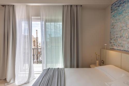 Postel nebo postele na pokoji v ubytování Taodomus Boutique Hotel