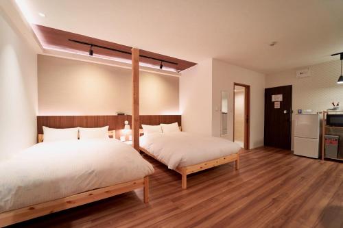 מיטה או מיטות בחדר ב-THE LOBS, RUSUTSU