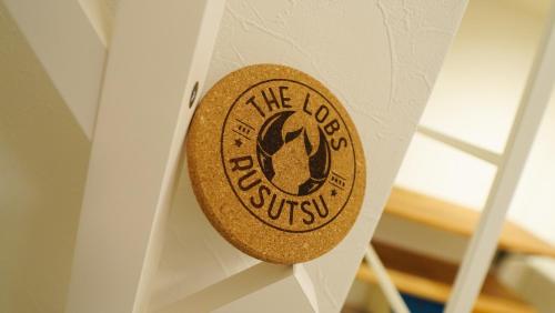 a sign that reads theork museum hanging on a wall at THE LOBS, RUSUTSU in Kimobetsu