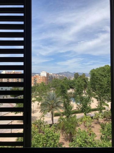 a view of a beach from a window at Doña Lola in Castellón de la Plana