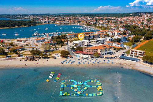 an aerial view of a beach and a city at A'more Bijeca - 20m from the beach - NEW & MODERN - 2023 in Medulin