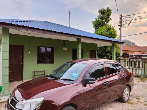 a car parked in front of a house at TBE Room2stay at Jalan BR3 in Melaka