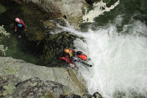 two people on a raft in a waterfall at HI Sjoa in Otta