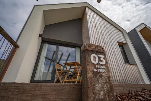 a house with a sign in front of it at Balarés Hotel da Natureza in Ponteceso