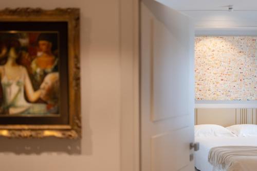 Postel nebo postele na pokoji v ubytování Taodomus Boutique Hotel