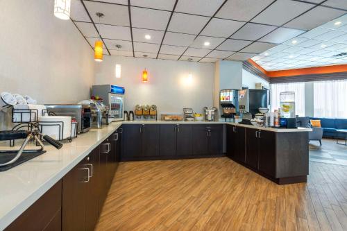 a large room with a hair salon with a barber shop at Comfort Inn & Suites Barrie in Barrie