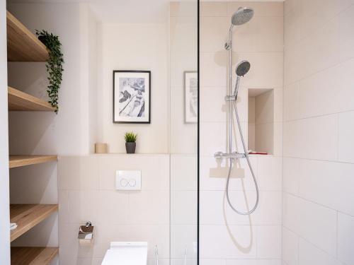 a bathroom with a shower and a toilet at Strandresidenz Else Marie App 1 4 in Ahlbeck