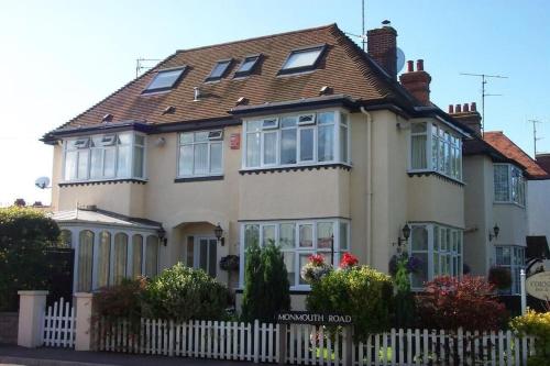 a large house with a white fence in front of it at Cornerways Guest House in Oxford