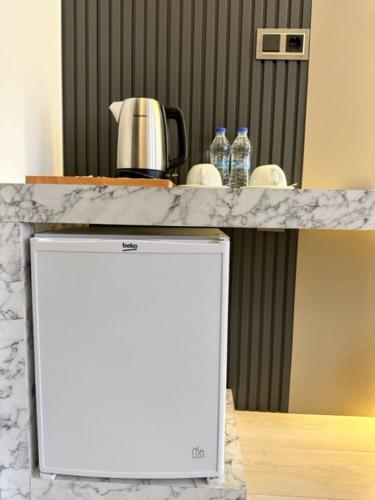 a counter top with a coffee pot on top of it at well house in Istanbul