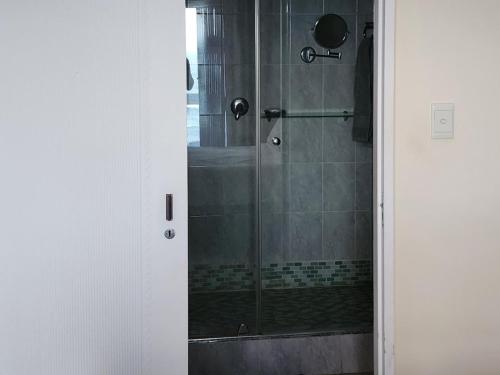 a shower with a glass door in a bathroom at 1 St Daniel in Ramsgate