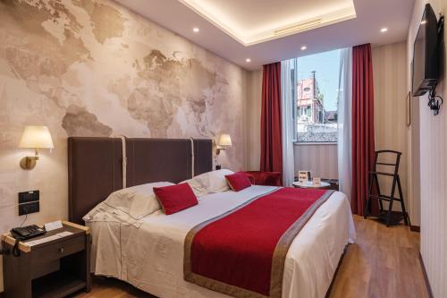 a hotel room with a bed with a map on the wall at Hotel Nazionale in Rome