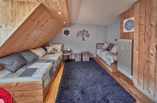 a room with two beds in a attic at Herzo Center Apartments in Herzogenaurach