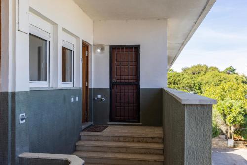 a front door of a house with stairs at Green Oasis in Parede by LovelyStay in Parede