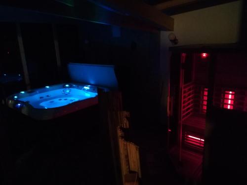 a dark room with a hot tub in the dark at Wellness privát Štyri Lipy in Liptovské Revúce