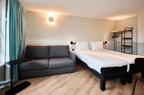 ibis Styles Paris Poissyにあるベッド