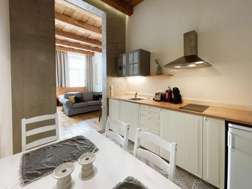 a kitchen with a table and chairs in a room at Old Town Square Apartments in Prague