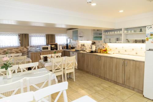 a kitchen and dining room with tables and chairs at Galley Hotel in Istanbul