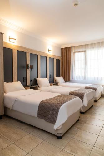 Ένα ή περισσότερα κρεβάτια σε δωμάτιο στο Galley Hotel