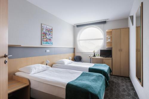 Katil atau katil-katil dalam bilik di Hotel Lechicka