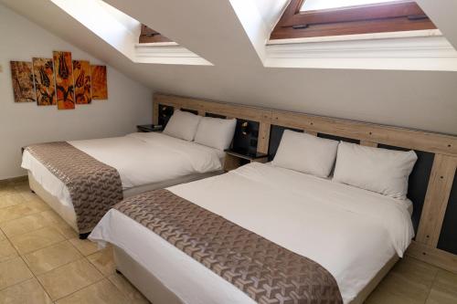 Ένα ή περισσότερα κρεβάτια σε δωμάτιο στο Galley Hotel
