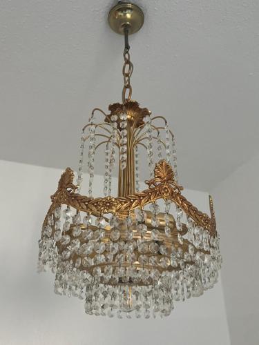 a chandelier hanging from a ceiling at Sweet Home cozy Dresden Apartment three in Dresden