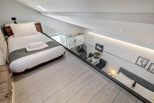 a room with a bed and a glass floor at Passaggio studio in Corfu Town