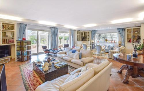 a large living room with couches and a table at Amazing Home With Pool in Nocera Terinese