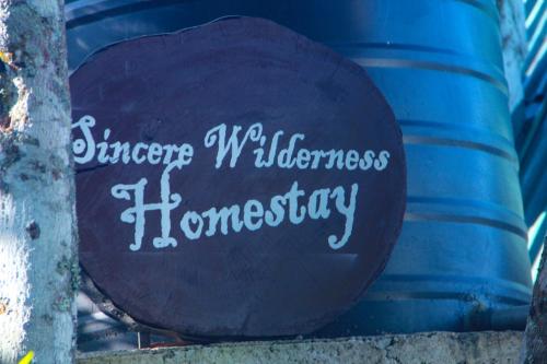 a sign that says ginger wellness homesery on a barrel at Sincere Wilderness Home stay in Nuwara Eliya