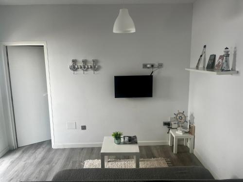 Televízia a/alebo spoločenská miestnosť v ubytovaní Casa Rosaura