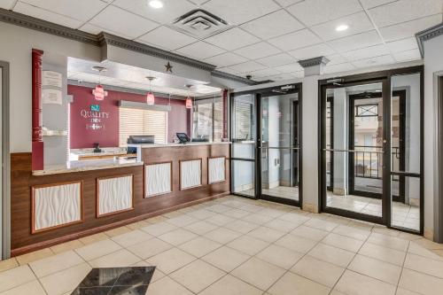 a lobby of a restaurant with glass doors at MainStay Suites Ozona I-10 in Ozona