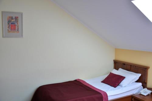 Una cama o camas en una habitación de Hotel Kopa - Lviv