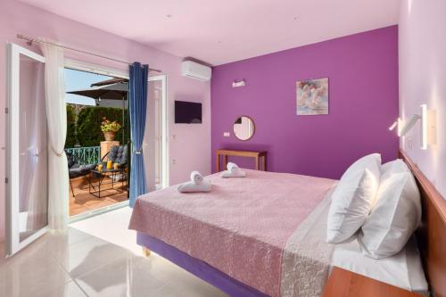Postel nebo postele na pokoji v ubytování Poseidon Suites by CorfuEscapes