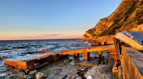 a view of the ocean from a pier at VillAlba Affittacamere in Camerano