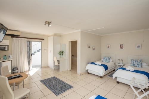 Ένα ή περισσότερα κρεβάτια σε δωμάτιο στο Millard Crescent Guest House