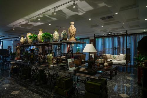 a room filled with lots of vases on shelves at Amanaki Thao Dien in Ho Chi Minh City