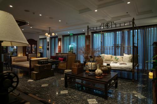 a living room with a couch and a table at Amanaki Thao Dien in Ho Chi Minh City