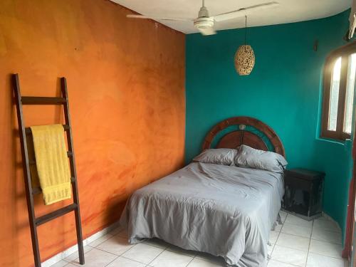 een slaapkamer met een bed en een ladder erin bij Villa Oasis-Studio Room in Puerto Vallarta
