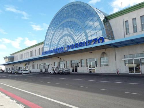 a building with a sign on the side of it at HomeAway Pescara Airport in San Giovanni Teatino