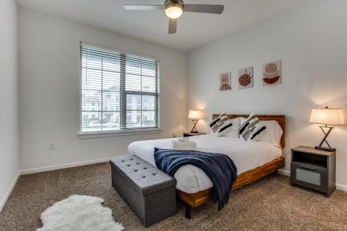 a bedroom with a large bed and a window at Astonishing CozySuites on I-35 with pool&parking #10 in Pflugerville