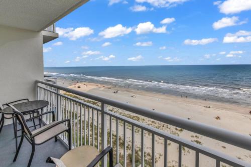a balcony with a view of the beach at Breathtaking 2BR Condo w Floor-to-Ceiling Windows Overlooking Ocean in Myrtle Beach