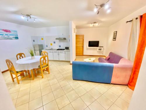a living room with a couch and a table at Center Point in Diego Suarez