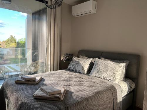 מיטה או מיטות בחדר ב-Luxe Sea