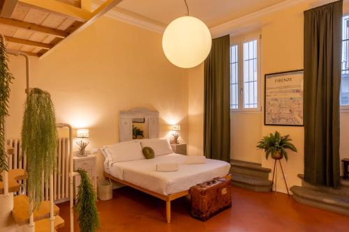 Postel nebo postele na pokoji v ubytování Secret Garden Firenze B&B