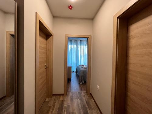 a hallway leading to a bedroom with a bed at Luxe Sea in St. St. Constantine and Helena