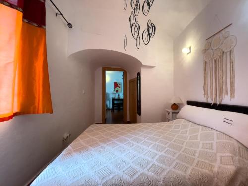 a bedroom with a large bed in a room at Évora City Break Apartment with Patio in the Historic Centre in Évora