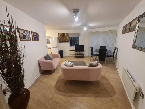 a living room with two chairs and a couch at 2 Bedroom 2 Bath Apartment, sleeps 4, Town Centre in Wolverhampton