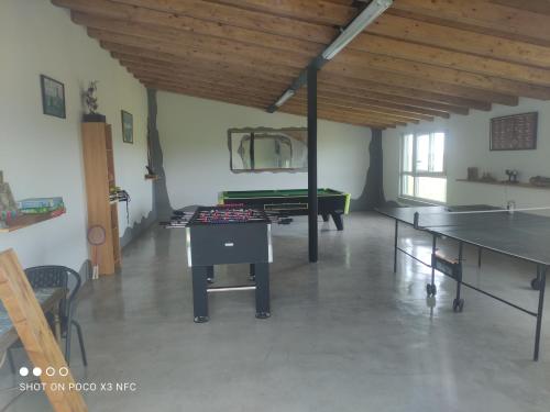 a room with ping pong tables and a pool table at Apartamentos Santa Justa in Ubiarco